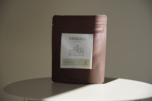 Ceremonial grade Japanese matcha powder by Yasumu in minimalist packaging, 30g tin